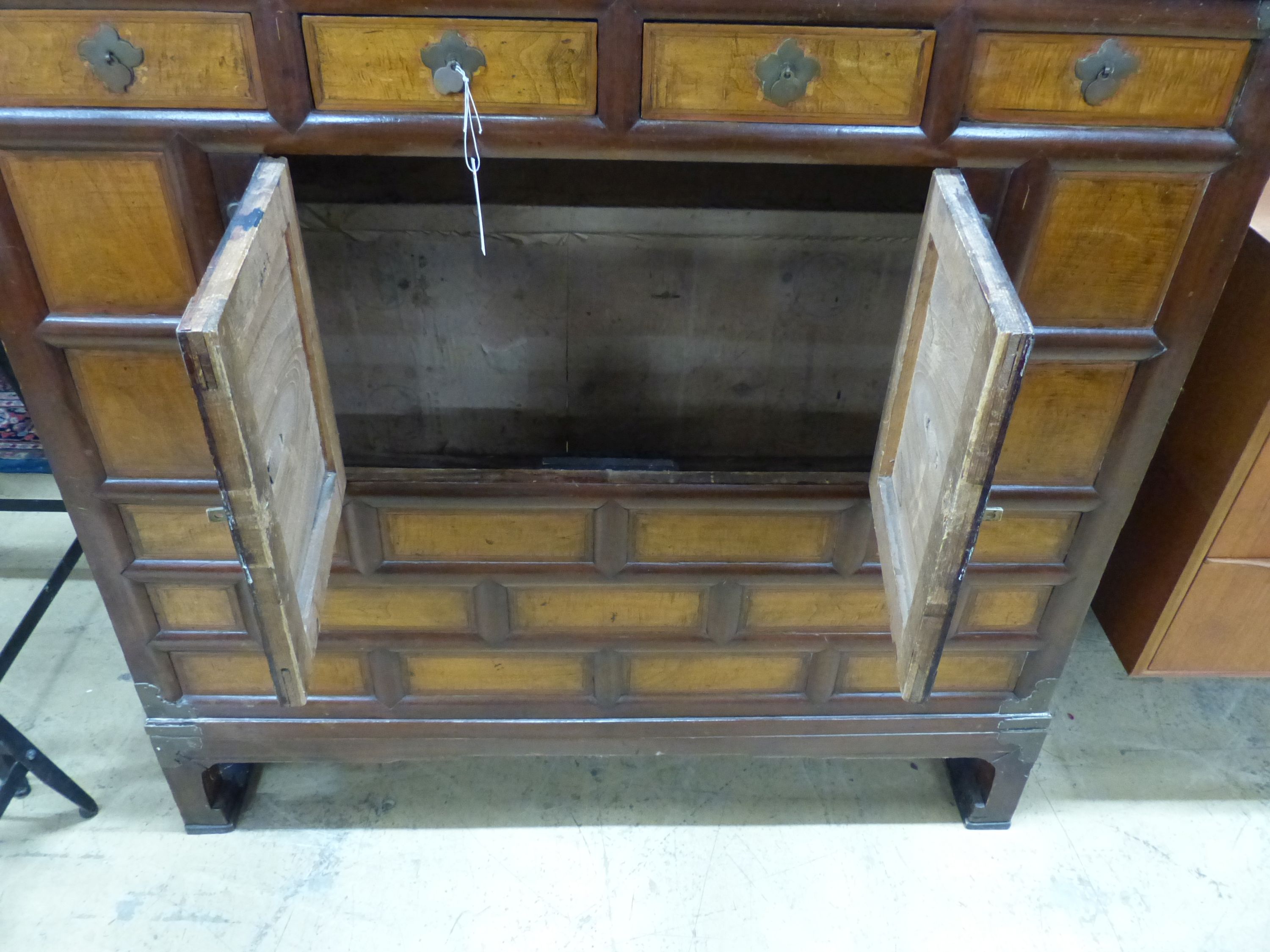 A Chinese elm cabinet, width 111cm